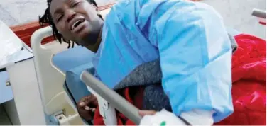  ?? Reuters ?? A migrant reacts at a hospital bed after being rescued by Libyan coast guard in Sabratha on Tuesday.