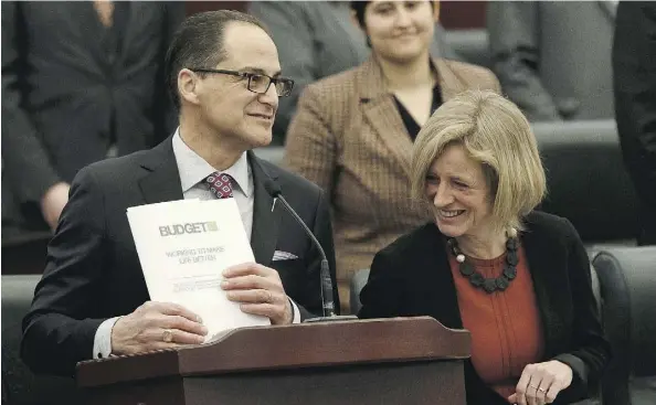  ?? IAN KUCERAK ?? Finance Minister Joe Ceci stands alongside Premier Rachel Notley as he tables Budget 2017 in the Alberta Legislatur­e on Thursday.