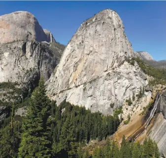  ?? Tom Stienstra / The Chronicle ?? On a loop hike from Yosemite Valley, you can get this view of 7,076-foot Liberty Cap, the little-seen south flank of 8,842-foot Half Dome and below to 594-foot Nevada Fall.