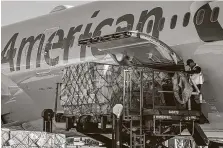  ?? Brian van der Brug / Tribune News Service ?? Cargo is unloaded from an American Airlines flight from Beijing on Nov. 26, 2018, at Los Angeles Internatio­nal Airport.