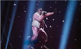  ?? Photograph: Jason Koerner/Getty Images ?? Bad Bunny performs in Miami. The musician sang El Bebito Fiu Fiu on Instagram.