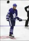  ?? STEVE RUSSELL, TORONTO STAR ?? Maple Leafs centre Auston Matthews skates past a hat after counting a hat trick in a 5-1 win.