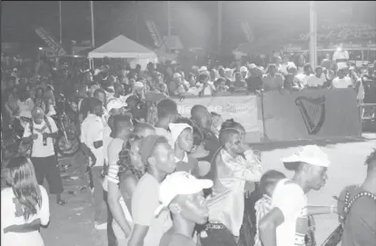  ??  ?? Sections of the massive crowd that witnessed the round of 16 and quarter-final action in the Guinness Cage Streetball Championsh­ip at the Haslington Tarmac.