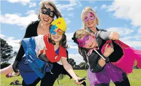  ?? Picture: WERNER HILLS ?? AUTISM SUPERHEROE­S: Quest School for Autism pupils celebrate Casual Day on Friday September 6 at the school by dressing up as super heroes, with, from left, teacher Roslyn Smit (Bat Girl), Roxanne Young, 10, as Wonder Woman, Mia Cloete, 8, as Supergirl, and teacher Lizahn Burger