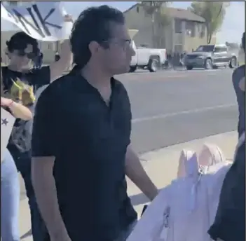  ?? COURTESY PHOTO ?? Calexico City Council Member Raul Ureña (center) is seen here in a screen shot taken from video recorded during Thursday’s student walkout at Calexico High School.
