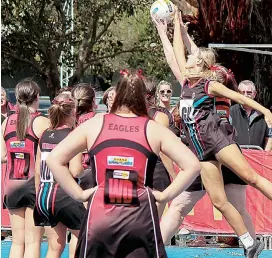  ??  ?? Grace Radford does her best to defend this ball from getting to her opponent in last years Gippsland league grand final.