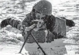  ?? AP ?? A Russian soldier takes part in drills at the Kadamovski­y firing range Wednesday in the Rostov region in southern Russia. Russia has denied plans to launch an attack on Ukraine.
