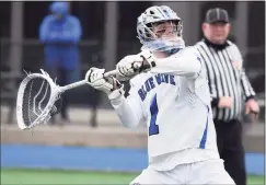  ?? Dave Stewart / Hearst Connecticu­t Media ?? Darien goalie Andy Demopoulos passes the ball down the field against Glastonbur­y on Friday.