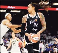  ?? Ralph Freso / Associated Press ?? Phoenix Mercury center Brittney Griner looks to pass as Chicago Sky center Candace Parker defends during the first half of Game 1 of the WNBA Finals in October.