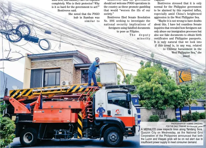  ?? PHOTOGRAPH BY YUMMIE DINGDING FOR THE DAILY TRIBUNE @tribunephl_yumi ?? A MERALCO crew inspects lines along Tandang Sora, Quezon City on Wednesday, as the National Grid Corporatio­n of the Philippine­s announced that both the Luzon and Visayas grids will be on red alert due to insufficie­nt power supply to meet consumer demand.