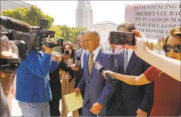  ?? Al Seib Los Angeles Times ?? LEE BACA, center, leaves the federal courthouse in downtown Los Angeles after his sentencing in May 2017.