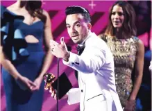  ??  ?? Luis Fonsi accepts the award for record of the year for ‘Despacito’ at the 18th annual Latin Grammy Awards at the MGM Grand Garden Arena on Thursday in Las Vegas. (Reuters)