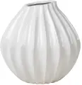  ??  ?? Consider sculptural pieces, such as this wide ceramic vase in Ivory, £49.50 from Broste Copenhagen, to add texture andinteres­t to a chest of drawers