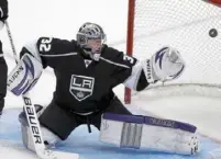  ?? ?? ABOVE: Tristan Jarry collects himself during Game 4 of the series vs. the Islanders in May. LEFT: Jonathan Quick allows one of his 21 goals to Vancouver in 2010 — his first playoff series.