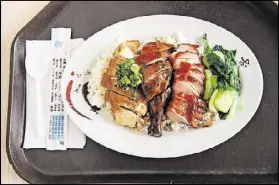  ??  ?? The Hong Kong BBQ offers mixed barbecue on rice with three meats — chicken, roast duck and pork.