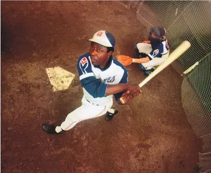  ?? ASSOCIATED PRESS ?? Hank Aaron, shown in batting practice during 1974. endured racist threats with stoic dignity during his pursuit of Babe Ruth but went on to break the career home run record in the pre-steroids era.