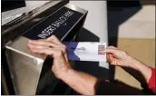  ?? MATT ROURKE - THE ASSOCIATED PRESS ?? A person drops off a mail-in ballot at an election ballot return box in Willow Grove on Oct. 25, 2021. Pennsylvan­ia officials were asked about policies regarding drop boxes and mail ballots that had disqualify­ing technical errors.