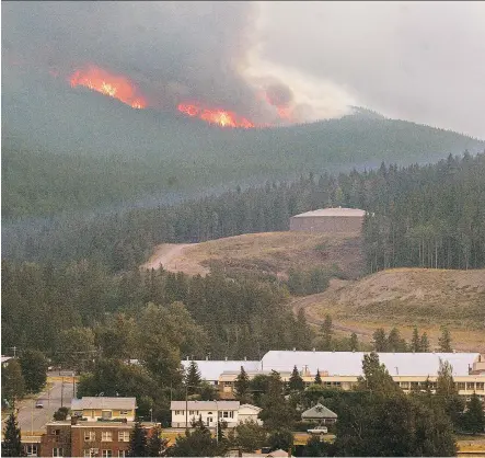  ?? FILES ?? The Lost Creek fire engulfs the area south of Turtle Mountain and Blairmore in 2003. The Crowsnest Pass community’s fire crews and provincial officials have increased patrols to ensure fire ban compliance as parched conditions heightened concerns.