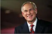  ?? NICK WAGNER — AUSTIN AMERICAN-STATESMAN VIA AP ?? Texas Governor Greg Abbott smiles before a gubernator­ial debate against his Democratic challenger Lupe Valdez at the LBJ Library in Austin, Texas. Decisions about health care and education will top the agenda in many state capitols as lawmakers convene in new sessions in 2019. Abbott and the Republican-controlled Legislatur­e will be wrestling with whether to tap as much as $5 billion from the state’s rainy-day fund to pay for the recovery from Hurricane Harvey, which swamped the southeast portion of the state in August 2017.