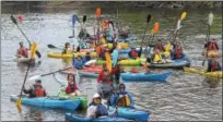  ?? DIGITAL FIRST MEDIA FILE PHOTO ?? Kayaks get together for a group photo before paddling the Schuylkill River in April 2016. Sly Fox Brewery is hosting its annual SRT Spree this weekend to mark the launch of its season SRT Ale to benefit the Schuylkill River Trail. Kayakers will paddle...