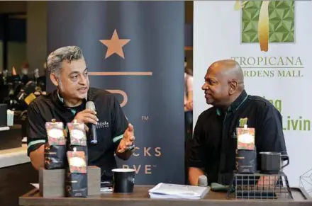  ??  ?? Berjaya Food Bhd group chief executive officer Sydney Quays (left) and Tropicana Gardens Mall managing director Andrew Ashvin attending an event at the Starbucks outlet in the mall in Kota Damansara yesterday.