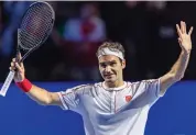  ?? — AFP ?? Switzerlan­d’s Roger Federer acknowledg­es the crowd after beating Moldova’s Radu Albot.