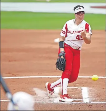  ?? [BRYAN TERRY/ THE OKLAHOMAN] ?? Oklahoma pitcher Giselle Juarez remained calm, cool and collected Friday afternoon when Northweste­rn threatened to score in Game 1 of a Super Regional at Marita Hynes Field in Norman. The Sooners won, 3-0.