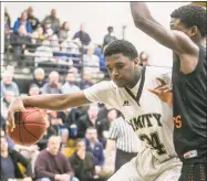  ?? John Vanacore / For Hearst Connecticu­t Media ?? Amity’s Tanner Thomas and the Amity boys basketball team will be the No. 2 seed in the upcoming SCC tournament.