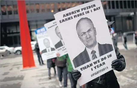  ?? Scott Olson Getty Images ?? ANDY PUZDER, President Trump’s pick to be the next Labor Department secretary, has infuriated worker-rights advocates.