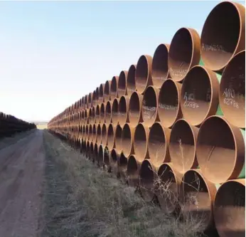  ?? ALEX PANETTA/THE CANADIAN PRESS ?? A yard in Gascoyne, N.D., which has hundreds of kilometres of pipes for the Keystone XL pipeline.