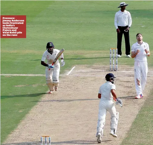  ??  ?? Pressure: Jimmy Anderson looks frustrated as India's Cheteshwar Pujara and Virat Kohli pile on the runs