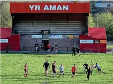  ??  ?? Grassroots: Amman’s pitch (left) is a far cry from the Principali­ty Stadium, and in the clubhouse a shrine to Lions hero Williams takes pride of place ATHENA PICTURE AGENCY