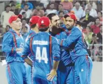  ?? Reuters ?? Afghan players celebrate the wicket of Bangladesh cricketer Sabbir Rahman (unseen) during the second Twenty20 match in Dehradun on Tuesday.