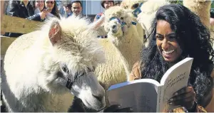  ?? Picture: Dougie Nicolson. ?? Thara Packiahraj­ah, vice-president of the student welfare committee, joined students to pet the alpacas in their pens.