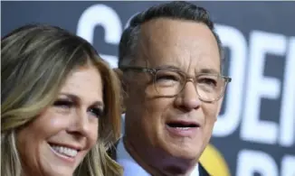  ?? Valerie Macon/AFP via Getty Images ?? Among the songs on Tom Hanks’ playlist is a duet between his wife, Rita Wilson, and Elvis Costello.