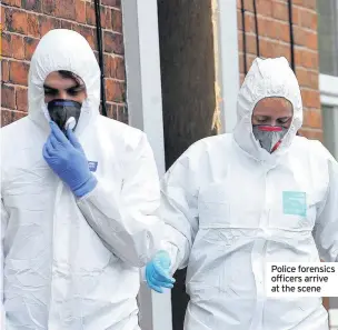  ??  ?? Police forensics officers arrive at the scene