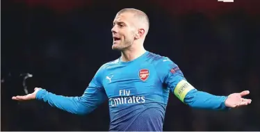  ?? PETER CZIBORRA/REUTERS ?? BEDA TREN: Jack Wilshere dan Arsenal bakal menghadapi striker AC Milan Patrick Cutrone (foto kiri) di San Siro dini hari nanti WIB (9/3).