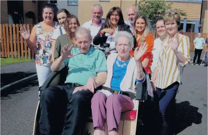  ??  ?? Wheely good Wallace View care home residents try out trishaw earlier this year