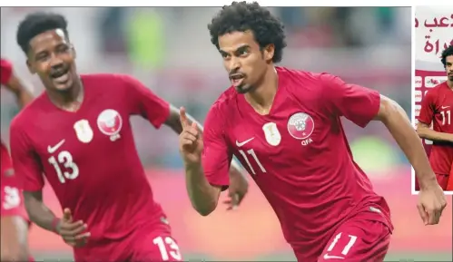  ??  ?? Qatar’s forward Akram Afif (right) celebrates one of his two goals against the UAE in the 24th Arabian Gulf Cup Group A match at the Khalifa Internatio­nal Stadium on Tuesday.