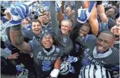  ?? JOE COMMERCIAL APPEAL ?? Memphis Head Coach Mike Norvell celebrates with his team as they defeat the Houston Cougars to win the AAC West title on Friday, Nov. 23. RONDONE/THE