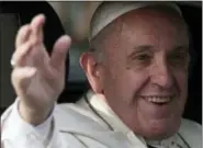  ?? LUIS HIDALGO — THE ASSOCIATED PRESS ?? Pope Francis waves as he arrives at the San Luis Beltran church on his way to the Apostolic Nunciature in Santiago, Chile, on Monday.