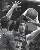  ?? JEFF SINER/CHARLOTTE OBSERVER ?? Frank Kamibsky, right, then with the Charlotte Hornets, looks to pass around the Raptors' Kawhi Leonard, on April 5, 2019 in Charlotte, N.C.