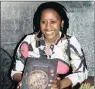  ??  ?? PROUD EXPORT: Nompumelel­o Mqwebu with her awardwinni­ng cookbook.
