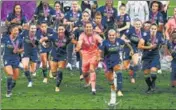  ??  ?? Lyon players celebrate their Women's Champions League title win against VfL Wolfsburg on Sunday.