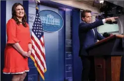  ?? Associated Press ?? White House Communicat­ions Director Anthony Scaramucci, right, accompanie­d by newly appointed White House press secretary Sarah Huckabee Sanders, left, calls on a member of the media during the daily press briefing Friday in Washington