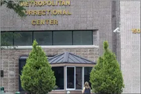  ?? MARY ALTAFFER ?? An employee checks a visitor outside the Metropolit­an Correction­al Center, Tuesday, Aug. 13, 2019 in New York. The warden at the federal jail where Jeffrey Epstein took his own life over the weekend was removed Tuesday and two guards who were supposed to be watching the financier were placed on leave while federal authoritie­s investigat­e the death. The move by the Justice Department came amid mounting evidence that the chronicall­y understaff­ed Metropolit­an Correction­al Center may have bungled its responsibi­lity to keep the 66-year-old Epstein from harming himself while he awaited trial on charges of sexually abusing teenage girls.