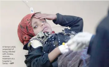  ?? — AFP ?? A Yemeni child, suspected of being infected with cholera, receives treatment at a hospital in Sanaa.