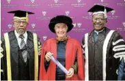  ?? ?? IMPRESSIVE CAREER: Honorary doctorate recipient Prof Janet Cherry is flanked by Rhodes University chancellor justice Lex Mpati, left, and vice-chancellor Prof Sizwe Mabizela