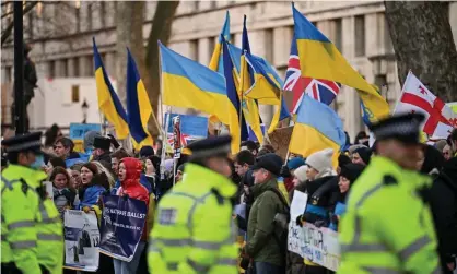  ?? ?? People protest in London against Russia’s invasion of Ukraine on Thursday. Photograph: Jeff J Mitchell/Getty Images