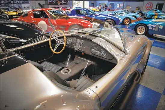  ?? Photograph­s by Allen J. Schaben Los Angeles Times ?? THE GT40 models based on the Le Mans winners start at about $170,000, a Cobra can be had for $100,000, and a Shelby Daytona can cost $180,00 to $400,000.